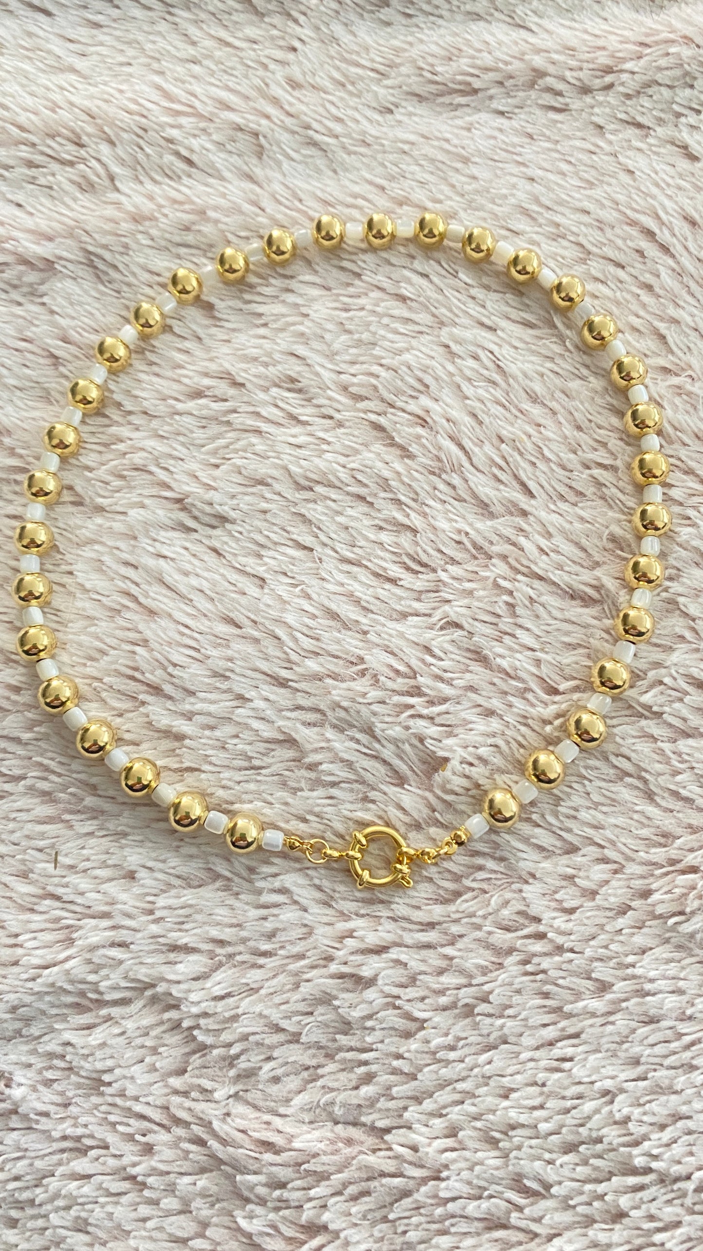 Gold and seashell necklace